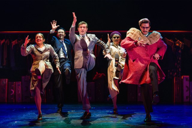 A group of actors pretending to run on stage