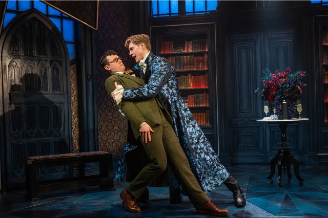 Two actors on stage dressed as Jonathan Harker and Count Dracula