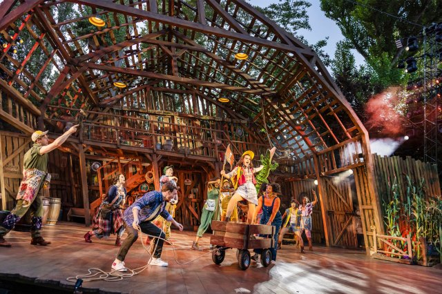 A group of actors in a barn dance scene, wearing Southern United States costumes