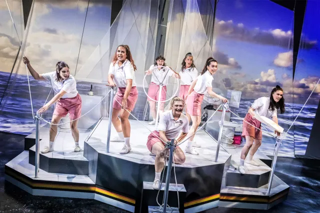 A group of actresses onboard an onstage sailing boat