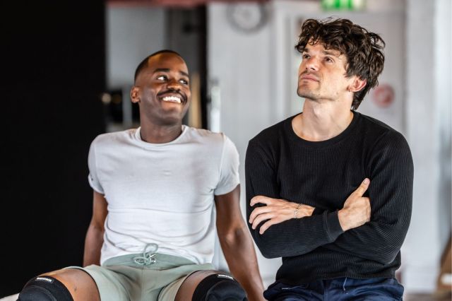 Ncuti Gatwa and Edward Bluemel in rehearsals for Born With Teeth, they smile at one another