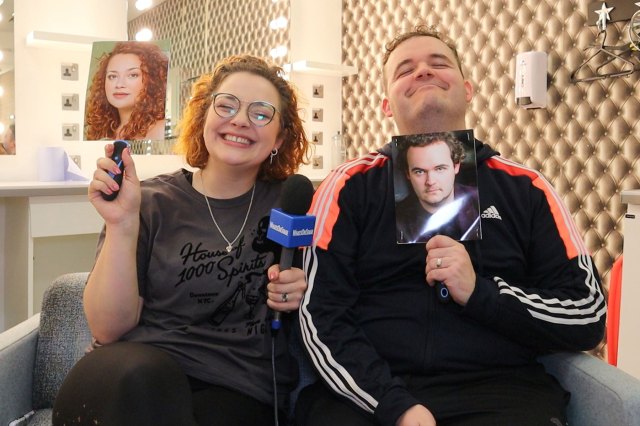 Actors Carrie Hope Fletcher and Joel Montague in a dressing room, holding up their respective headshots