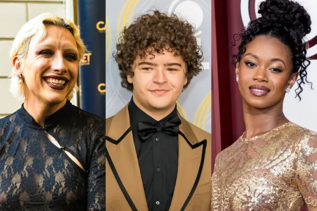 Three celebrities posing side by side on a red carpet: left a blonde woman in a black lace dress, middle a young man with curly hair in a tan suit and bow tie, right a woman in a gold sequined gown with an updo